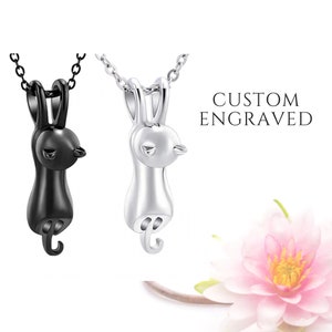 May include: Two silver necklaces with a rabbit pendant. The rabbit pendant is in a sitting position with its tail curled up. The text "CUSTOM ENGRAVED" is in the upper right corner of the image.
