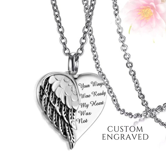 Collana con urna a forma di cuore con ali d'angelo e foto
