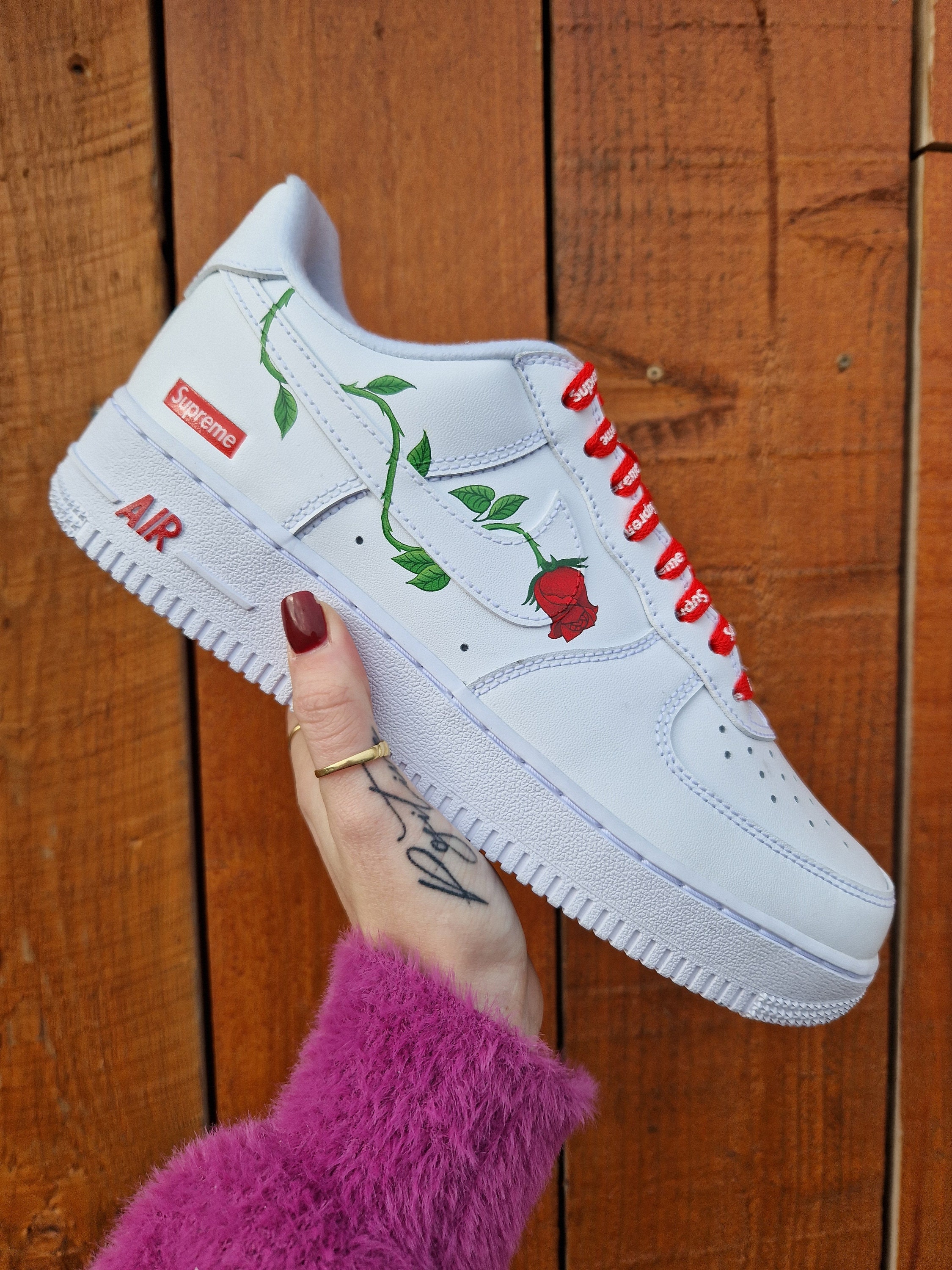 white and red air force 1 with rose