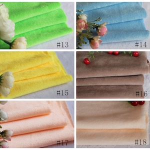 May include: Five different colors of soft, plush fabric swatches. The colors are green, yellow, brown, peach, and light blue. Each swatch is folded in thirds and labeled with a number.