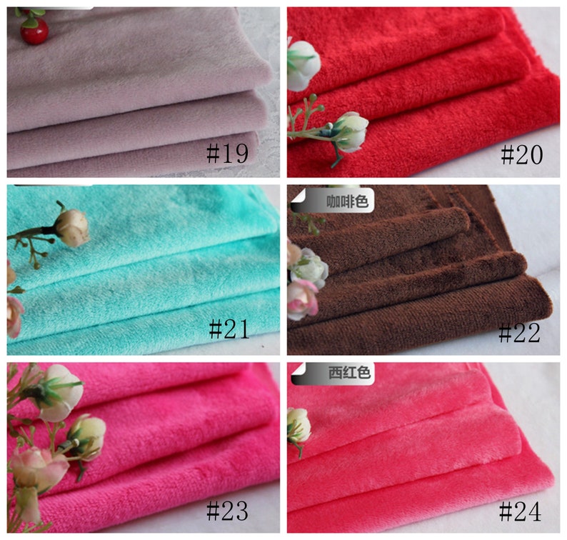May include: A collection of six fabric swatches in different colors, including light purple, red, turquoise, brown, pink, and a darker pink. Each swatch is folded in thirds and labeled with a number.
