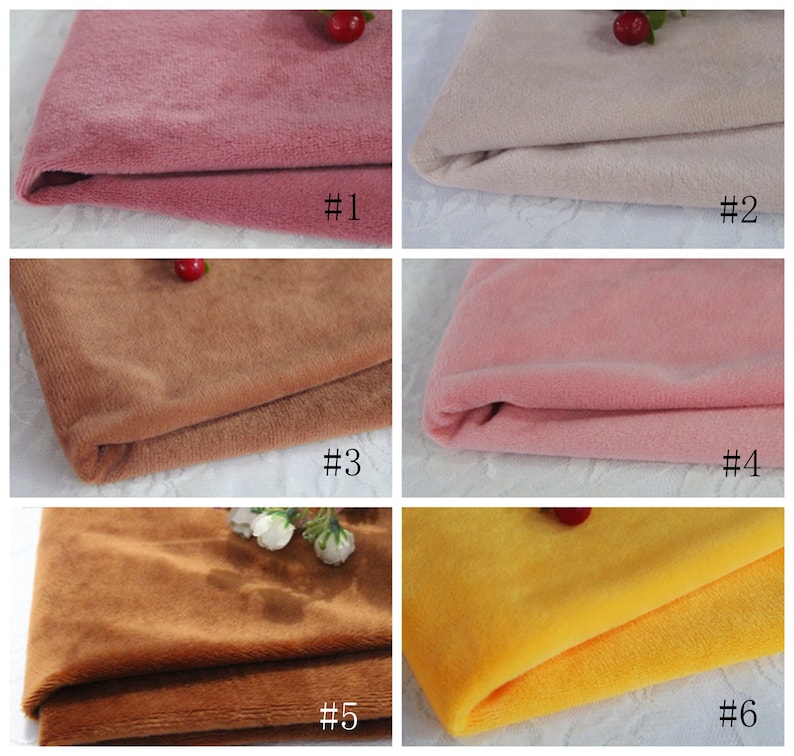 May include: Six fabric swatches in different colors, including pink, beige, brown, and yellow. The swatches are folded and arranged in a grid pattern. Each swatch is labeled with a number from 1 to 6.