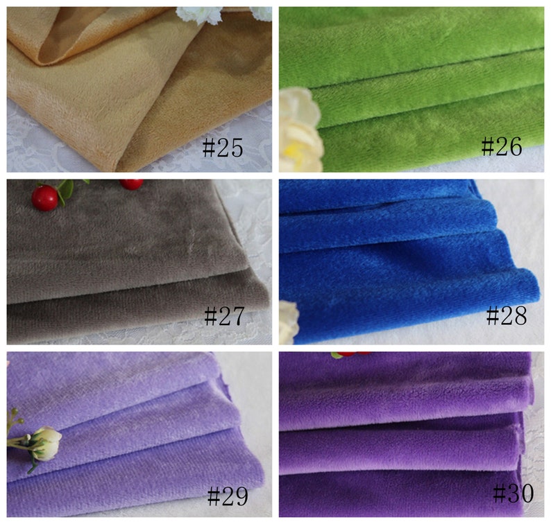 May include: Close-up of six fabric swatches in different colors. The swatches are folded in half and arranged in two rows of three. The colors are beige, green, gray, blue, purple, and lavender.