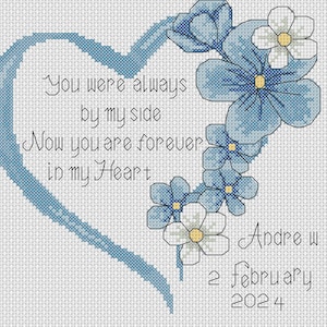 May include: A blue heart with the text "You were always by my side. Now you are forever in my Heart." surrounded by blue forget-me-not flowers. The text "Andre w 2 february 2024" is below the heart.