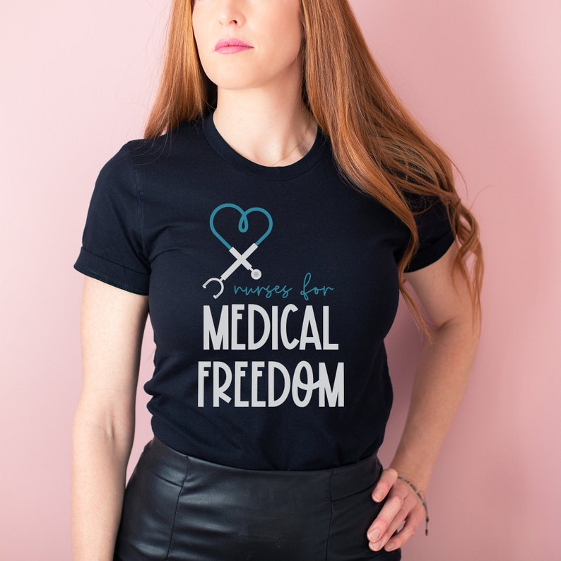 May include: A black t-shirt with a white graphic of a stethoscope in the shape of a heart and the text "Nurses for Medical Freedom".