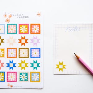 May include: A sheet of colourful stickers with a patchwork quilt design. The stickers feature a variety of colours, including pink, blue, yellow, green, and orange. The stickers are arranged in a grid pattern and are perfect for adding a touch of whimsy to any project.