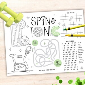 May include: A printable activity sheet with a spin and tonic theme. The sheet includes a word search, a noughts and crosses game, a maze, and a colouring page of a stationary bike. The sheet is decorated with lime slices, stars, and a disco ball.