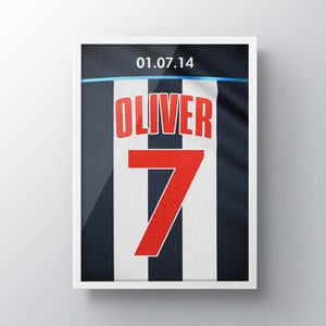 May include: A framed image of a white and black striped jersey with the number 7 and the name "Oliver" printed in red. The date "01.07.14" is printed at the top of the jersey.