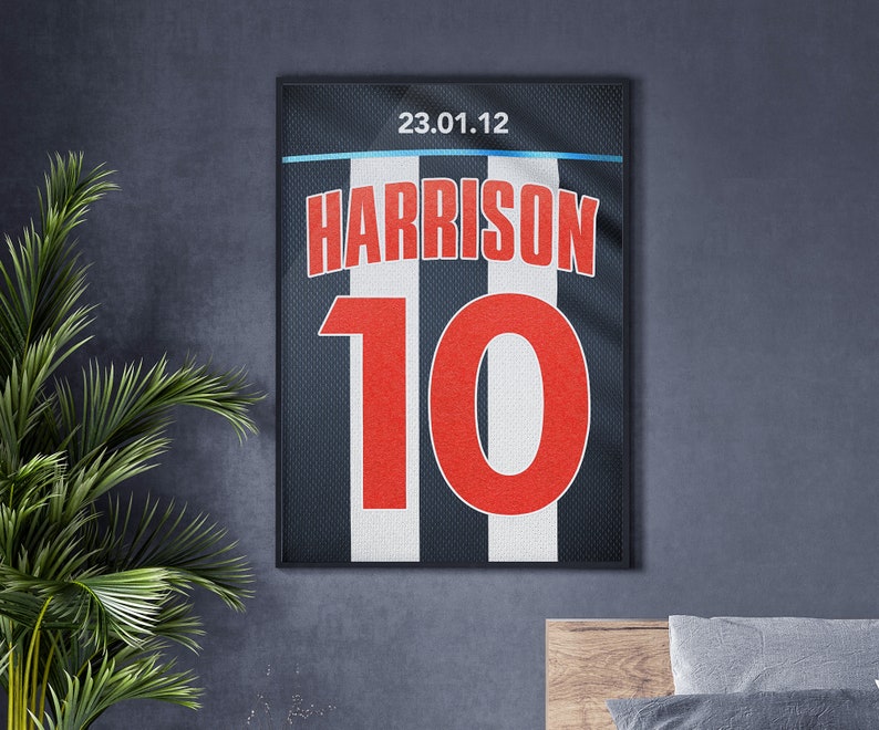 May include: A black and white striped jersey with the name "HARRISON" and the number "10" in red. The jersey has the date "23.01.12" printed on it.