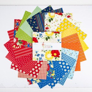 May include: A collection of fabric squares arranged in a circular pattern. The squares feature various floral and geometric patterns in red, blue, yellow, and green. The center of the arrangement displays a fabric bundle labeled "Summers in Town."