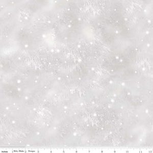 May include: White fabric with a textured, frosted appearance, resembling a snowy landscape. The design includes subtle, feathery patterns and scattered, sparkling white dots. The fabric is measured in inches.
