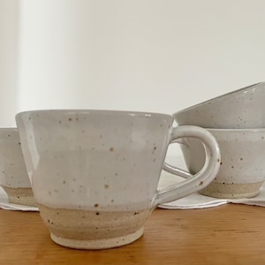 Ceramic stoneware cups with satin white glaze and flecked clay