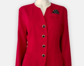 May include: A bright red blazer with a notched collar and four black and gold buttons. The blazer has long sleeves and two front pockets. A black and white polka dot pocket square is in the chest pocket.