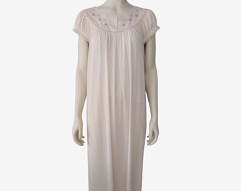 May include: A white cotton nightgown with short sleeves and a delicate floral embroidery around the neckline.