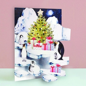 Papier gesneden kerstwenskaart | Kerstkaart pinguïn