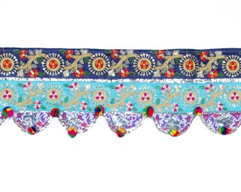 May include: A blue, turquoise, and silver embroidered trim with a scalloped edge and pom-poms.