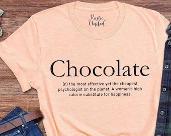 May include: A light peach colored t-shirt with a black graphic that reads "Chocolate (n) the most effective yet the cheapest psychologist on the planet. A woman's high calorie substitute for happiness."