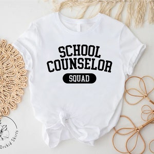 a white shirt that says school counselor squad