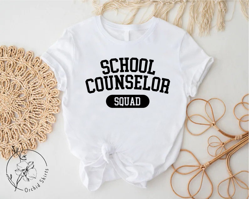 a white shirt that says school counselor squad