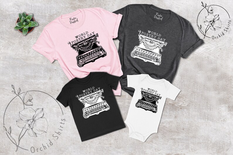 May include: A set of four t-shirts featuring a vintage typewriter graphic with the text "World Poetry Day". The shirts are in pink, grey, black, and white.