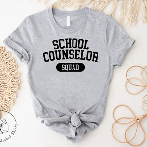 a t - shirt that says school counselor squad