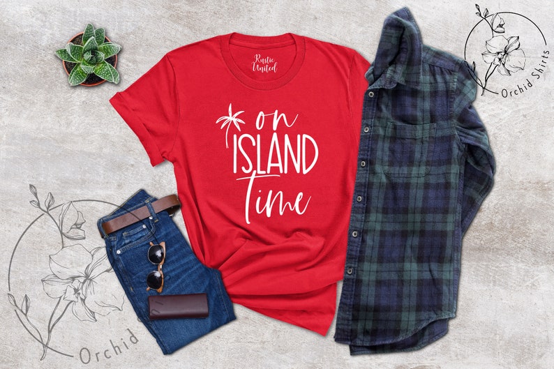 May include: Red t-shirt with white text that says "* on ISLAND time" with a palm tree graphic.