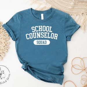 a t - shirt that says school counselor squad on it