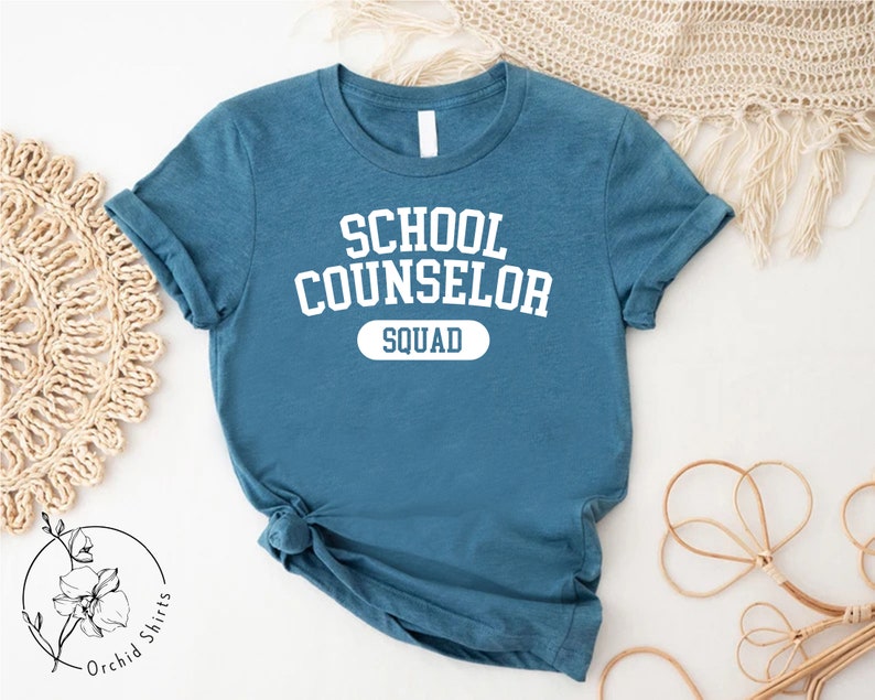 a t - shirt that says school counselor squad on it