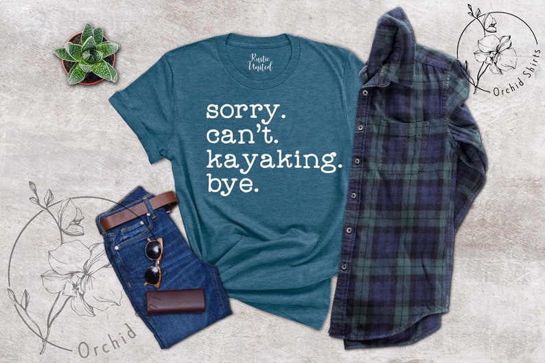 May include: A teal blue t-shirt with the text "sorry. can't. kayaking. bye." printed in white.