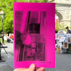 May include: A bright neon pink zine with a black and white high-contrast photographic print on the cover. The text "MISFIT CINEMA JOURNAL" is printed vertically, and "workprint #5" is written in black ink at the bottom right corner.