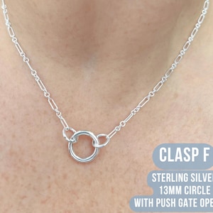 May include: A sterling silver necklace with a 13mm circle clasp and push gate opening. The necklace features a chain with rectangular links. The text "CLASP F" is visible in a blue rectangle.