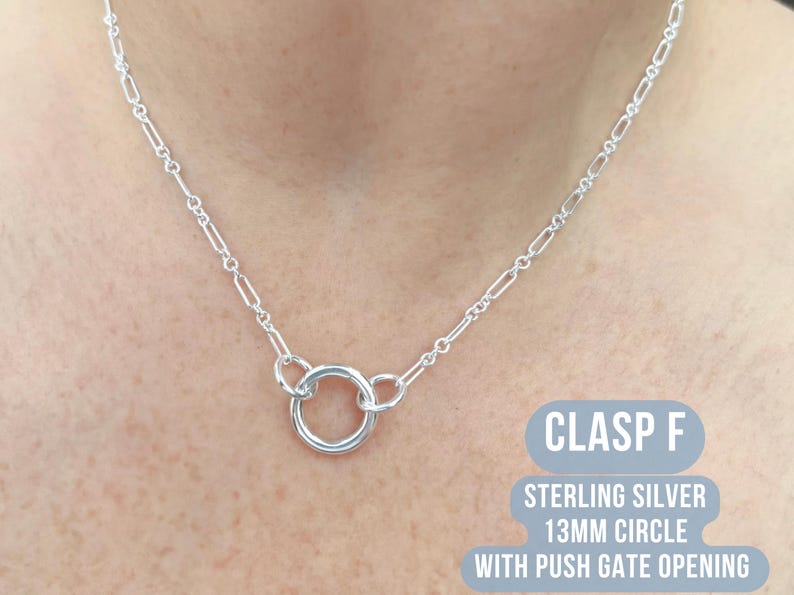 May include: A sterling silver necklace with a 13mm circle clasp and push gate opening. The necklace features a chain with rectangular links. The text "CLASP F" is visible in a blue rectangle.