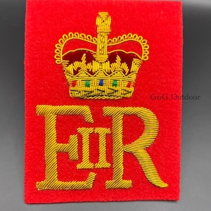 May include: A red felt patch with a gold embroidered crown and the letters "EIIR" in gold thread.