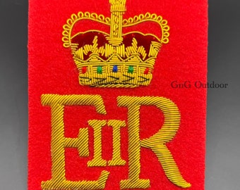 May include: A red felt patch with a gold embroidered crown and the letters "EIIR" in gold thread.
