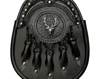May include: Black leather sporran with a silver stag head design and five leather tassels. The sporran is decorated with silver studs and has a braided leather strap.