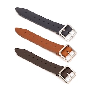 May include: Three leather straps in black, brown, and tan, each with a silver-coloured square buckle. The straps have multiple holes for adjustment and are arranged diagonally against a white background. The buckles are a shiny silver colour.