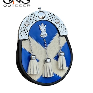 May include: A blue and white leather sporran with a silver Celtic knot design and a silver badge featuring a cross and a sword. The sporran has three white fur tassels.