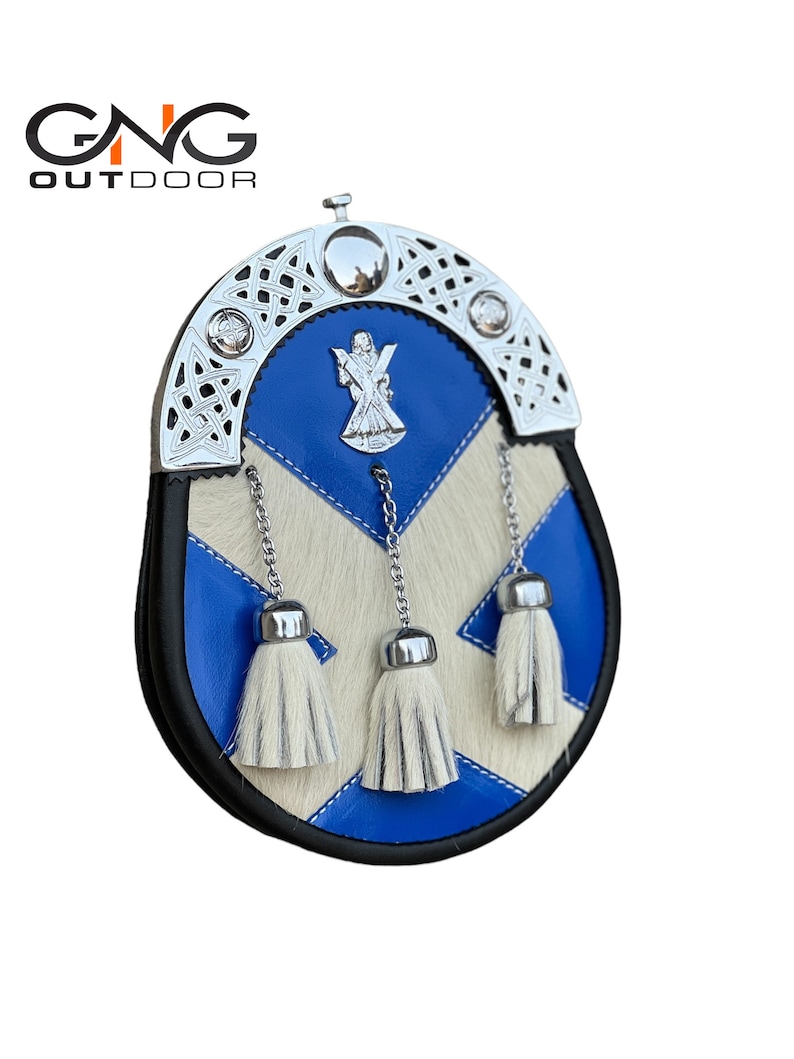 May include: A blue and white leather sporran with a silver Celtic knot design and a silver badge featuring a cross and a sword. The sporran has three white fur tassels.