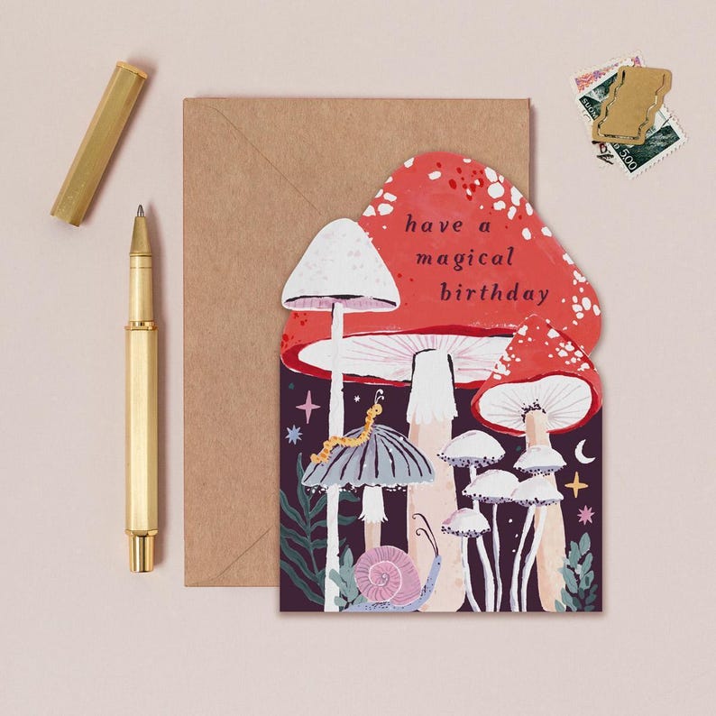This mushroom birthday card is cut into the shape of mushrooms in a glittering night sky with mystical bugs and stars around. The perfect magical mushroom birthday card for a witch or whimsigoth.