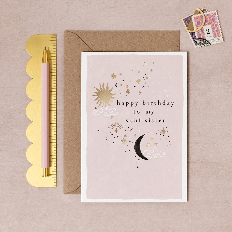 Soul Sister birthday card with goldshiny constellations and stars and a moon alongside the lettering happy birthday to my soul sister