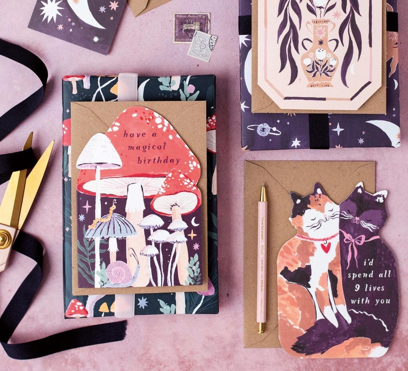 This mushroom birthday card is cut into the shape of mushrooms in a glittering night sky with mystical bugs and stars around. The perfect magical mushroom birthday card for a witch or whimsigoth.