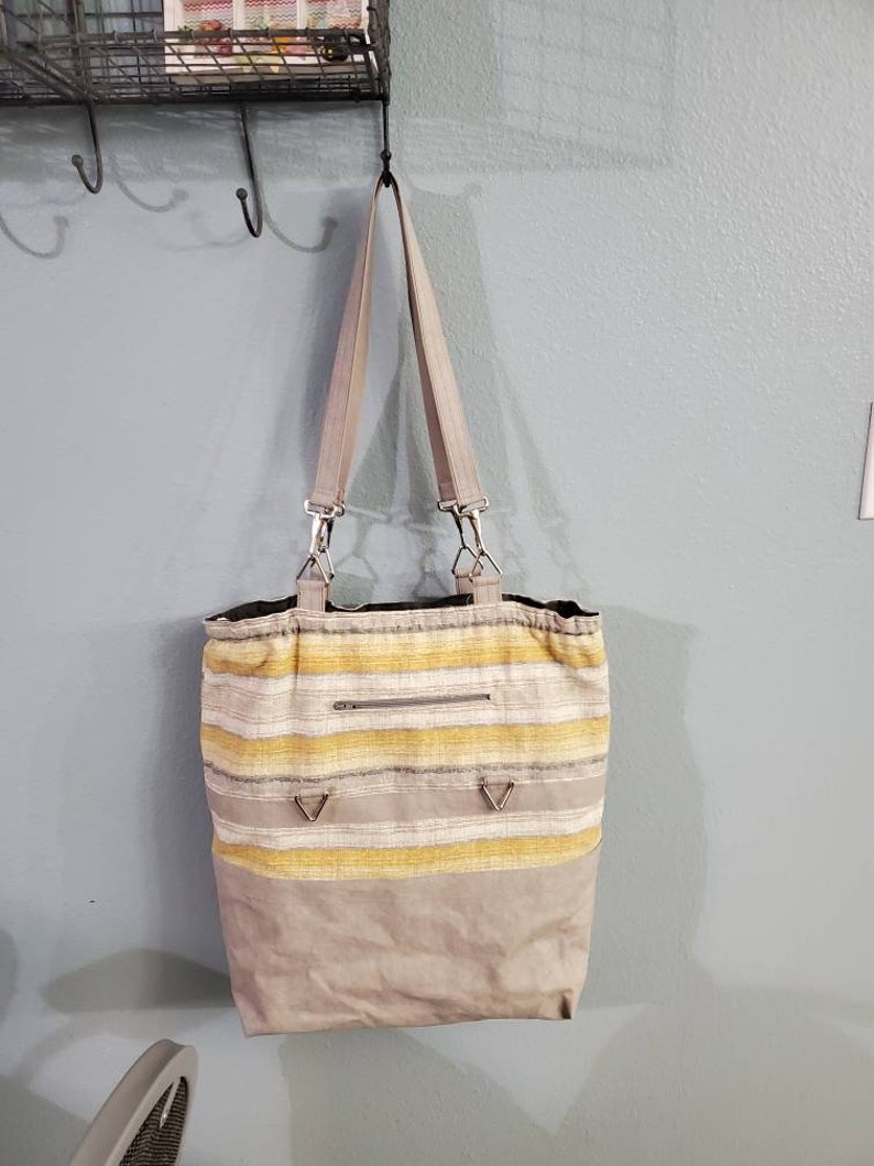 drawstring closure Project or Tote bag: versatile as a smaller tote inner pockets outer pocket with Kraft-tex taller tote