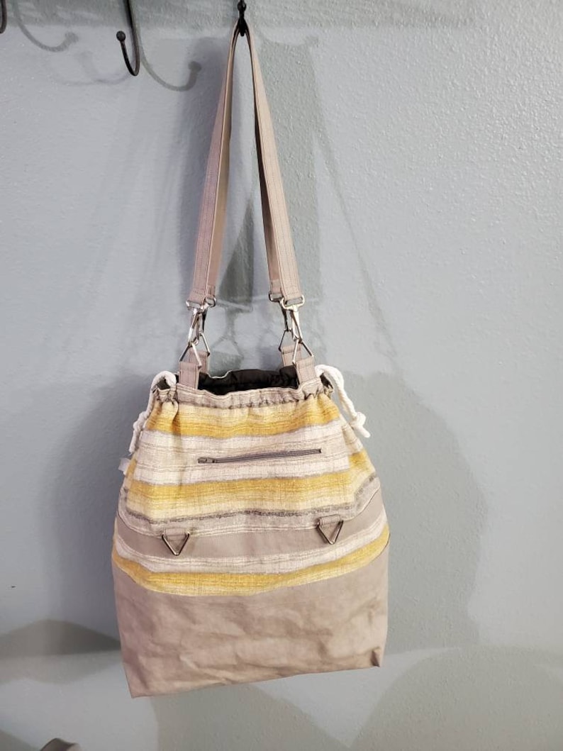 drawstring closure Project or Tote bag: versatile as a smaller tote inner pockets outer pocket with Kraft-tex taller tote