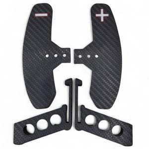 May include: Set of black carbon fiber paddle shifters with red and white accents. Includes two paddle shifters, two mounting brackets, and two support pieces. The paddle shifters have a textured surface.