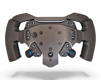 May include: A black carbon fiber racing steering wheel controller featuring a textured grip, multiple circular buttons labeled with letters like X, Y, A, B, LT, RT, LSB, RSB, and GL, along with two blue-accented rotary dials and a central G1 button.