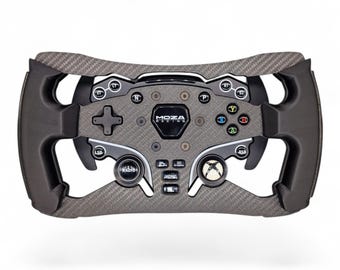 May include: A Moza Racing steering wheel controller featuring a carbon fiber textured frame, black ergonomic grips, and a central console with various buttons labeled LT, RT, S1, S2, N, P, LSB, RSB, Radio, and Home, alongside an Xbox logo button.