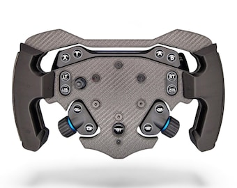 May include: A black carbon fiber racing steering wheel controller featuring a central plate with multiple buttons labeled A, B, X, Y, LT, RT, LSB, RSB, GL, GR, and GT. The device includes ergonomic side grips and integrated rotary dials with blue accents.
