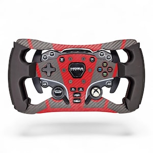 May include: A Moza Racing steering wheel controller featuring a red and black carbon fiber pattern. The device includes a central display, multiple labeled buttons, a directional pad, and an Xbox logo button, all set within a black frame.