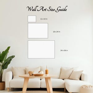 May include: A wall art size guide shows three rectangular canvas sizes: 28 x 36 cm, 46 x 61 cm, and 61 x 91 cm. The text "Wall Art Size Guide" is written in cursive at the top. The image is set against a white wall.
