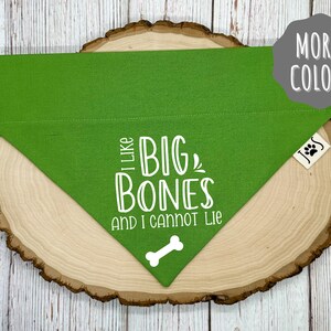 May include: Green dog bandana with white text that reads "I like big bones and I cannot lie" with a white bone graphic.